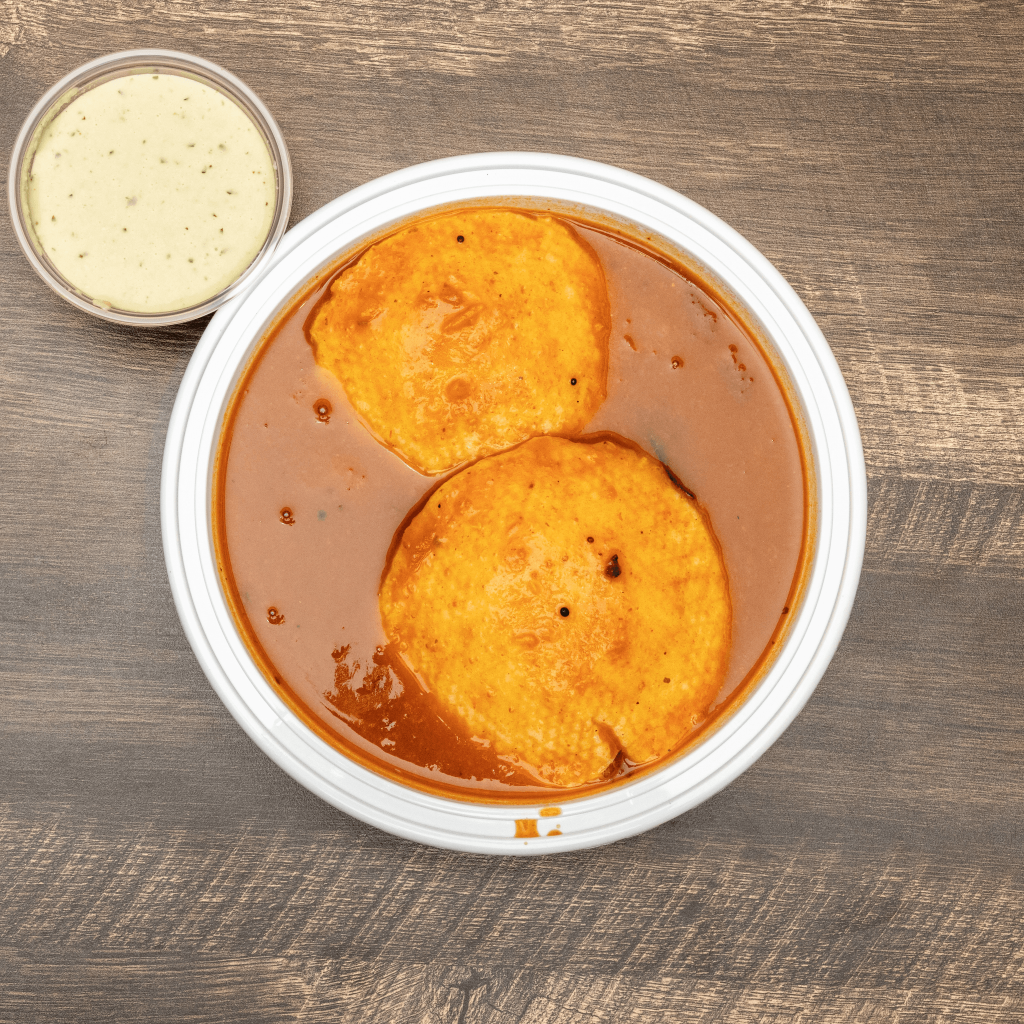 Idli in Sambar- 2Pc's (Comes with Chutney).