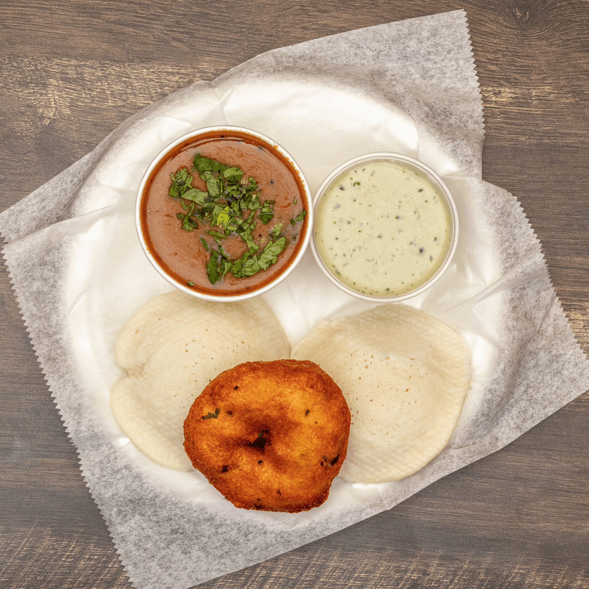 Combo 4 (1 Idli + 1 Medu Vada) Dipped in Sambhar.